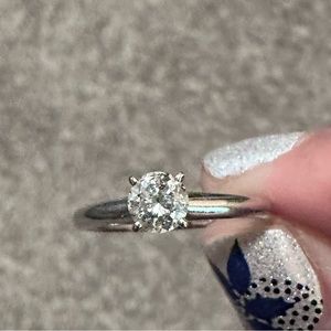 1/2 carat round solitaire J I2